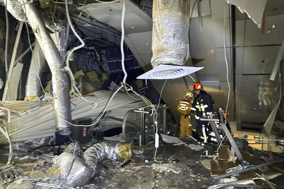 First responders survey the damage in the aftermath of an explosion at the Shin Kong Mitsukoshi department store in Taichung city in Taiwan on Feb. 13, 2025. (Taichung Fire Bureau via AP)