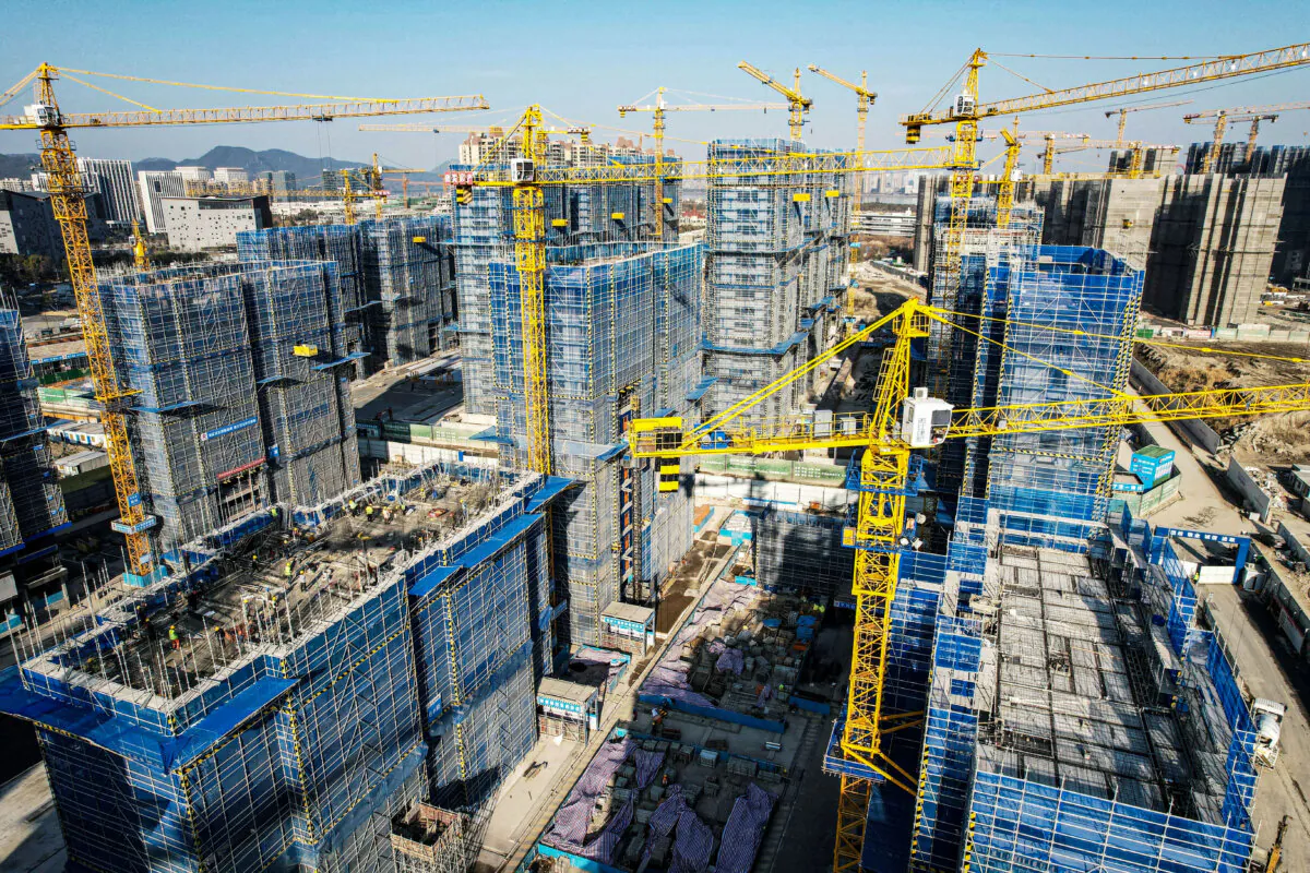 The aerial view shows residential buildings under construction by Chinese real estate developer Vanke in Hangzhou, in eastern China's Zhejiang Province, on March 15, 2024. (STR/AFP via Getty Images)