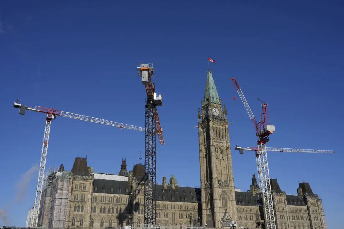 Cranes surround the Peace Tower on Parliament Hill in Ottawa as construction on centre block continues, on Jan.24, 2025. (The Canadian Press/Adrian Wyld)