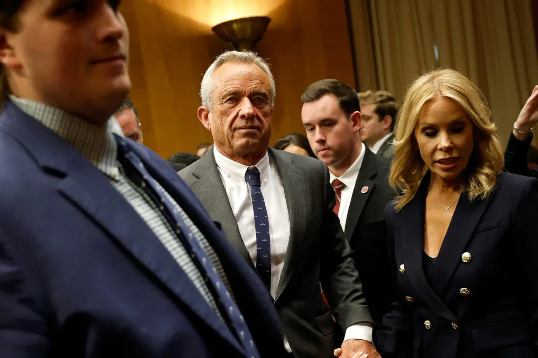 Robert F. Kennedy Jr., President Donald Trump’s nominee for secretary of the Department of Health and Human Services, departs with his wife Cheryl Hines after a confirmation hearing before the Senate Committee on Health, Education, Labor, and Pensions at the Dirksen Senate Office Building in Washington, on Jan. 30, 2025. (Kevin Dietsch/Getty Images)
