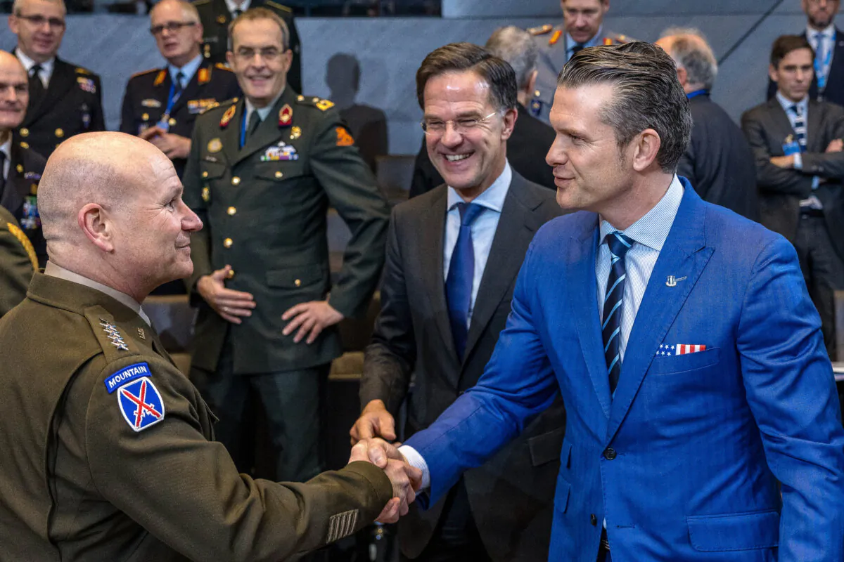 U.S. Defense Secretary Pete Hegseth (R) greets Supreme Allied Commander Europe General Christopher Cavoli (L) as NATO Secretary General Mark Rutte (C) looks on before the start of the North Atlantic Council meeting of Defence Ministers in Brussels, Belgium, on Feb. 13, 2025.  (Omar Havana/Getty Images)