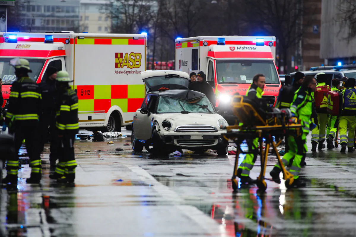 Police and emergency services stand near a damaged car after the driver apparently drove into demonstrators marching in the city center in Munich, Germany, on Feb. 13, 2025. According to initial reports, 20 people were injured. Police have detained the driver. The incident comes a day before the start of the Munich Security Conference, which draws scores of foreign government officials to the city. (Johannes Simon/Getty Images)