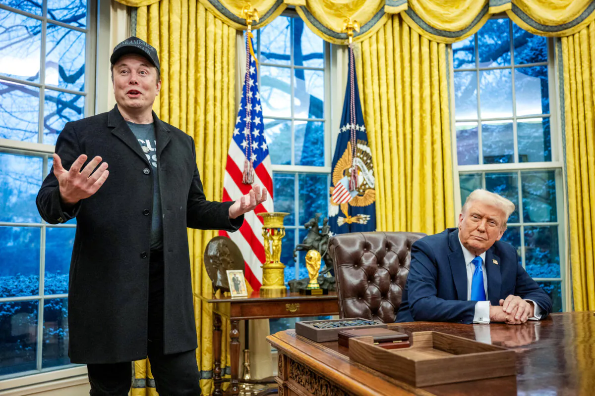 Elon Musk speaks as President Donald Trump looks on in the Oval Office of the White House on Feb. 11, 2025. (Jim Watson/AFP via Getty Images)