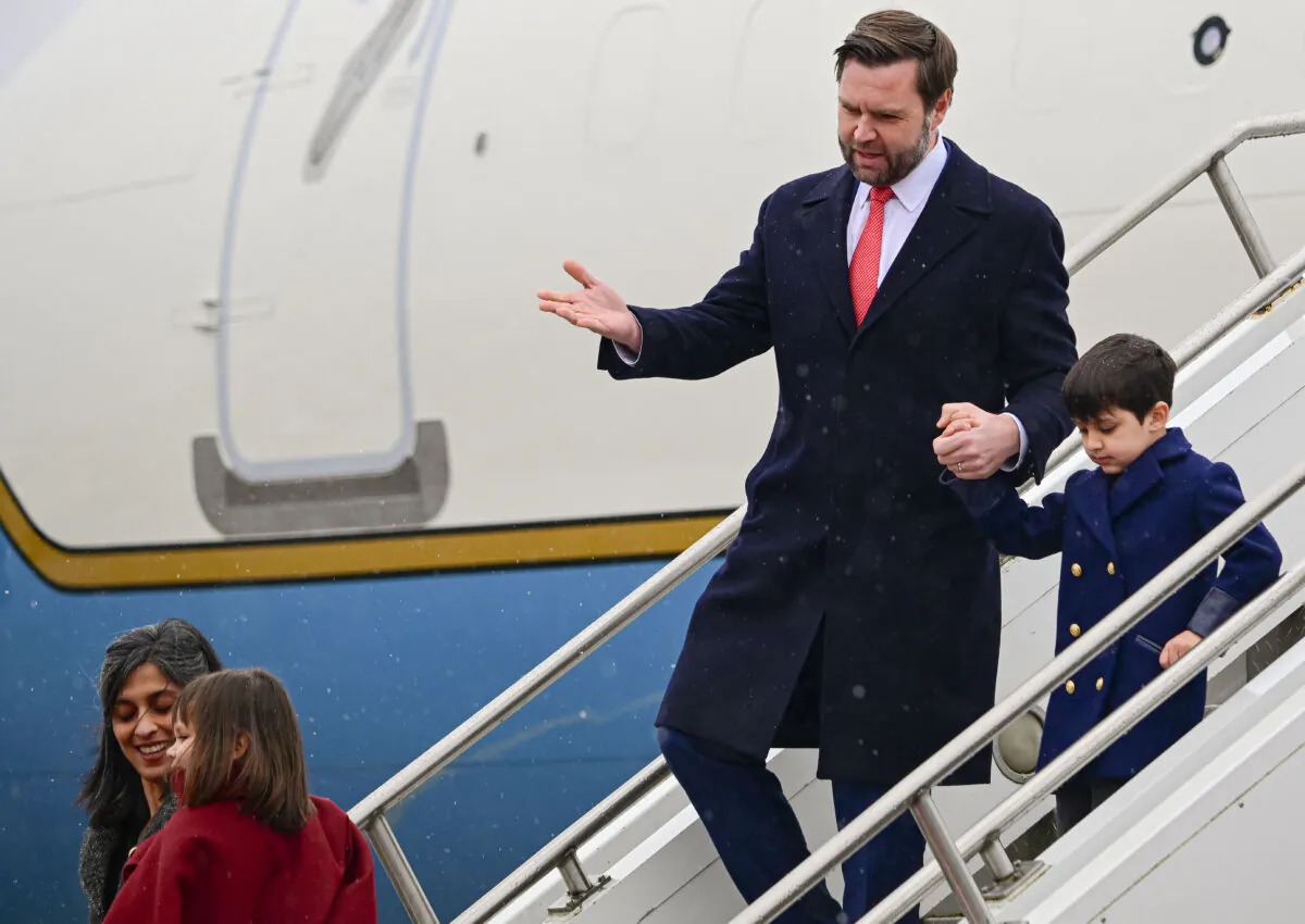 U.S. Vice President JD Vance, his wife Usha Vance and their children walk down the stairs after landing at Munich International Airport, Germany, on Feb. 13, 2025, one day before the start of the Munich Security Conference. (Tobias Schwarz/AFP via Getty Images)