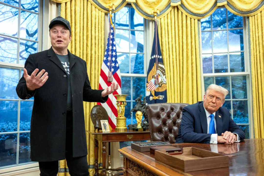 Elon Musk (L) speaks as President Donald Trump looks on in the Oval Office of the White House on Feb. 11, 2025. (Jim Watson/AFP via Getty Images)