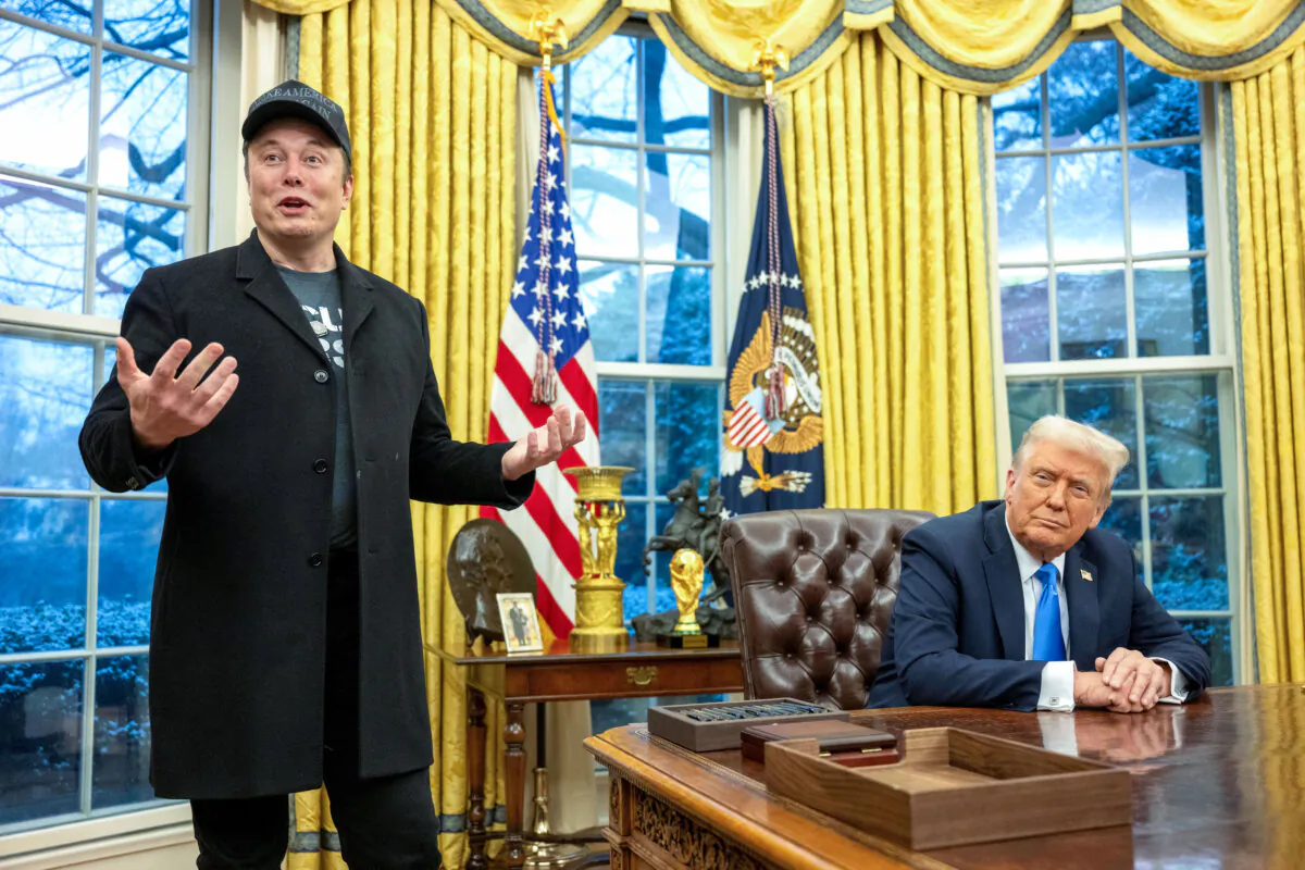 Elon Musk (L) speaks as President Donald Trump looks on in the Oval Office of the White House on Feb. 11, 2025. (Jim Watson/AFP via Getty Images)