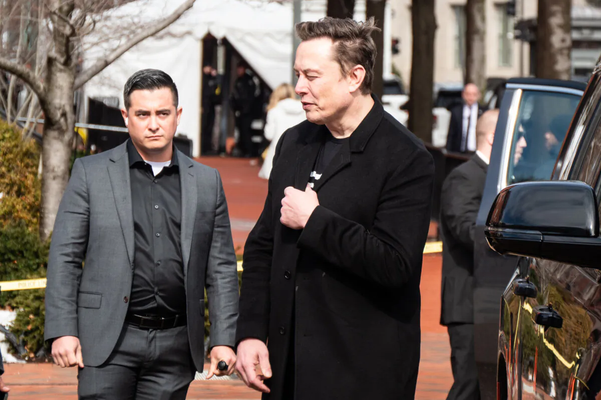 Tesla and SpaceX CEO Elon Musk walks into the White House grounds in Washington on Feb. 13, 2025. (Travis Gillmore/The Epoch Times)
