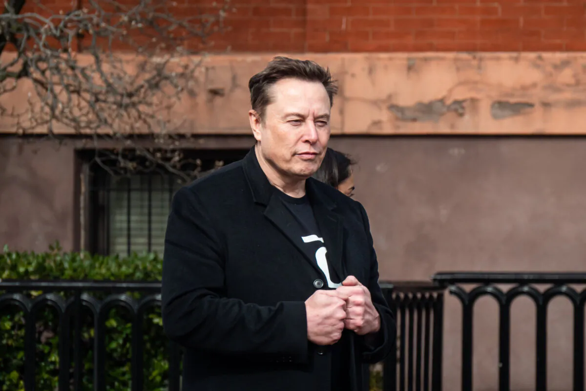 Tesla and SpaceX CEO Elon Musk walking into the White House grounds in Washington on Feb. 13, 2025. (Travis Gillmore/The Epoch Times)