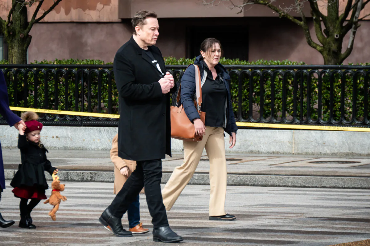 Tesla and SpaceX CEO Elon Musk walks into the White House grounds in Washington on Feb. 13, 2025. (Travis Gillmore/The Epoch Times)