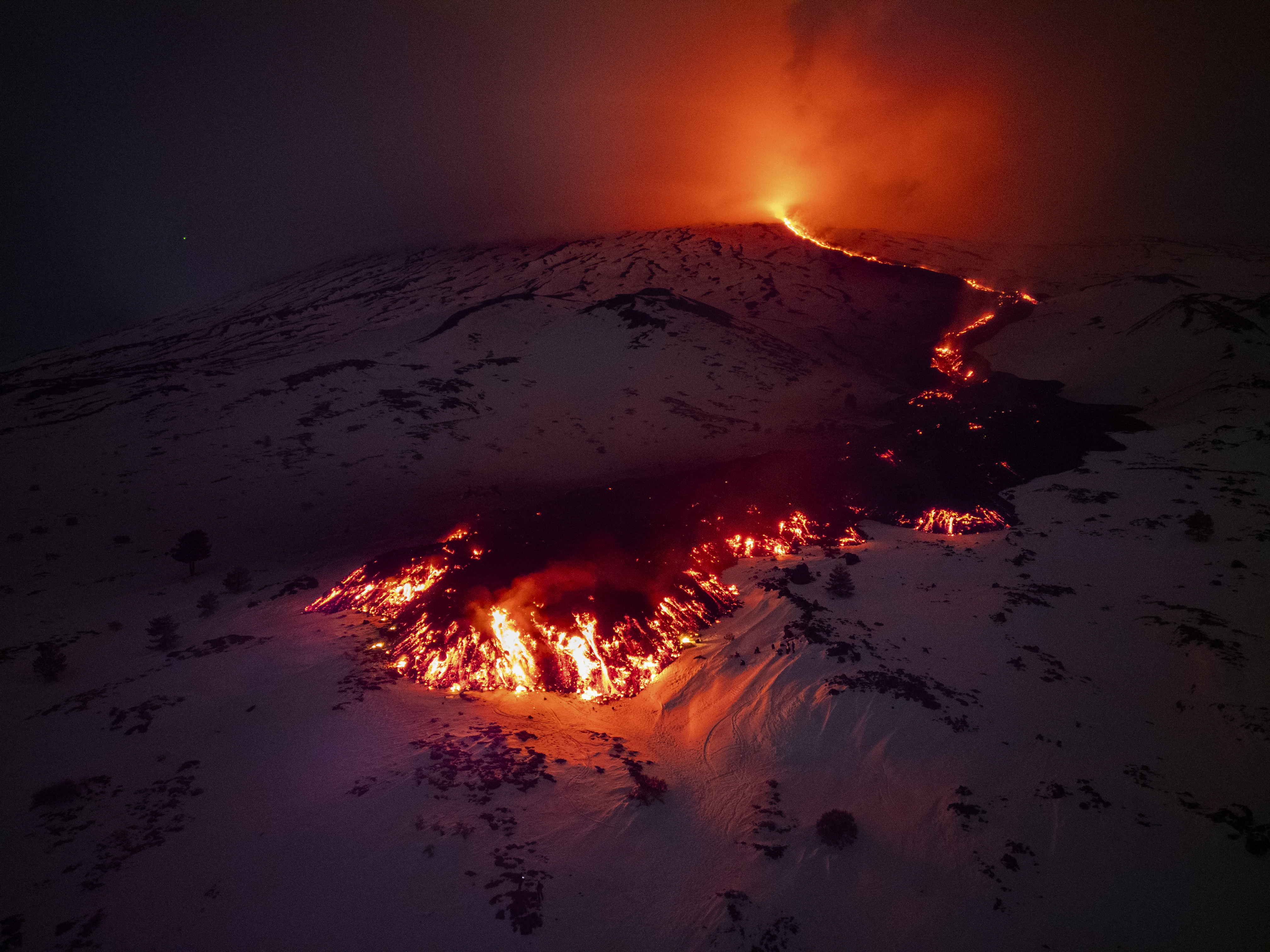 Day in Photos: Etna Eruption, Bridge Collapsed in Peru, and Valentines Celebrations