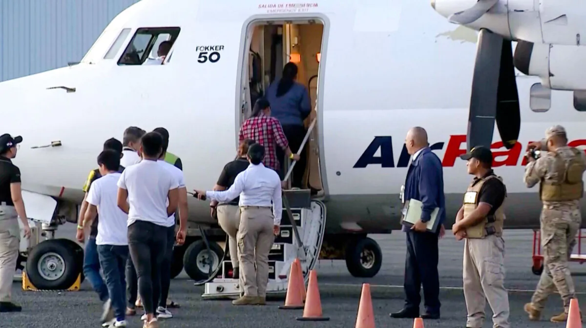 People board a deportation flight from Panama funded by the United States, in Panama City on Feb. 13, 2025. (Telemetro via AP/Screenshot via The Epoch Times)