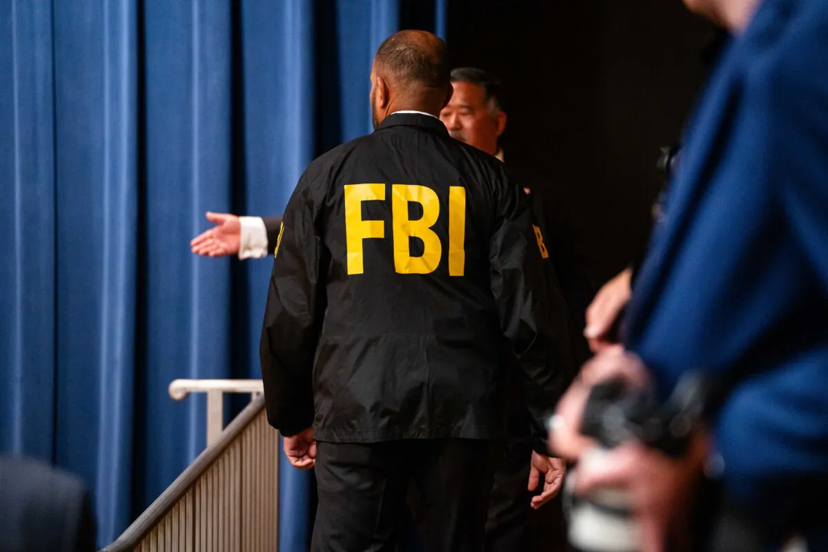 An FBI agent at the Department of Justice in Washington on Feb. 12, 2025. (Madalina Vasiliu/The Epoch Times)