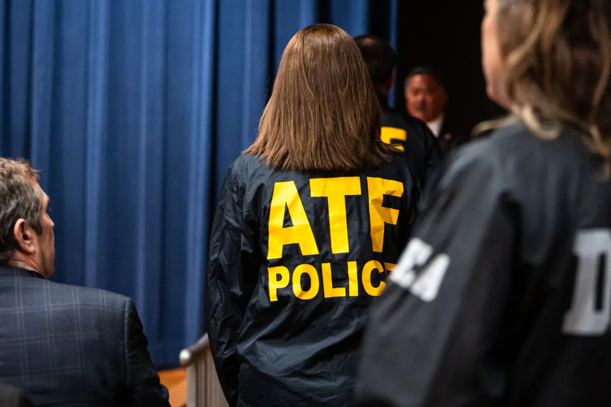 A Bureau of Alcohol, Tobacco, Firearms, and Explosives (ATF) agent at the Department of Justice in Washington on Feb. 12, 2025. (Madalina Vasiliu/The Epoch Times)