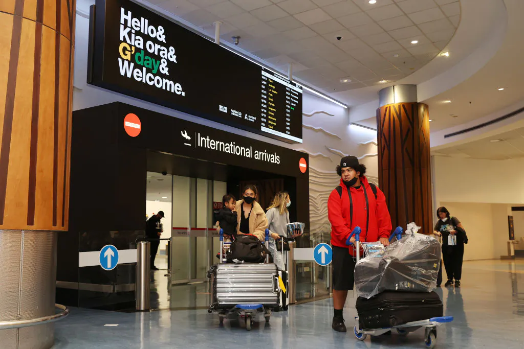 Tourists, friends and family are welcomed to Auckland International Airport in Auckland, New Zealand, on April 13, 2022. (Fiona Goodall/Getty Images)