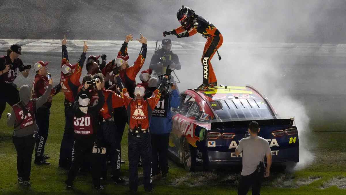 William Byron, on car, celebrates with his pit crew after winning the NASCAR Daytona 500 auto race at Daytona International Speedway in Daytona Beach, Fla., on Feb. 16, 2025. (Chris O'Meara/AP Photo)