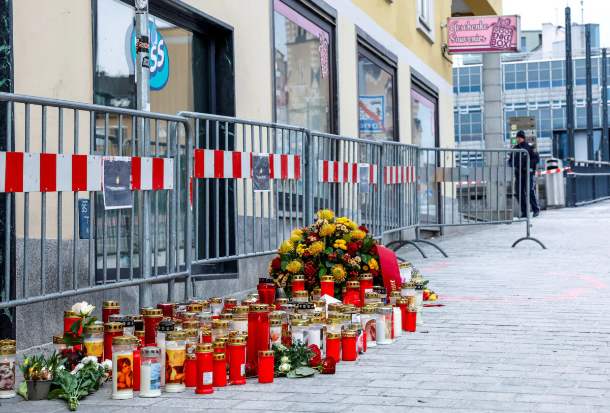 Candles and flowers placed at the site where a 14-year-old boy was killed and several others were wounded in a stabbing attack, in the town of Villach, Austria, on Feb. 16, 2025. (Borut Zivulovic/Reuters)