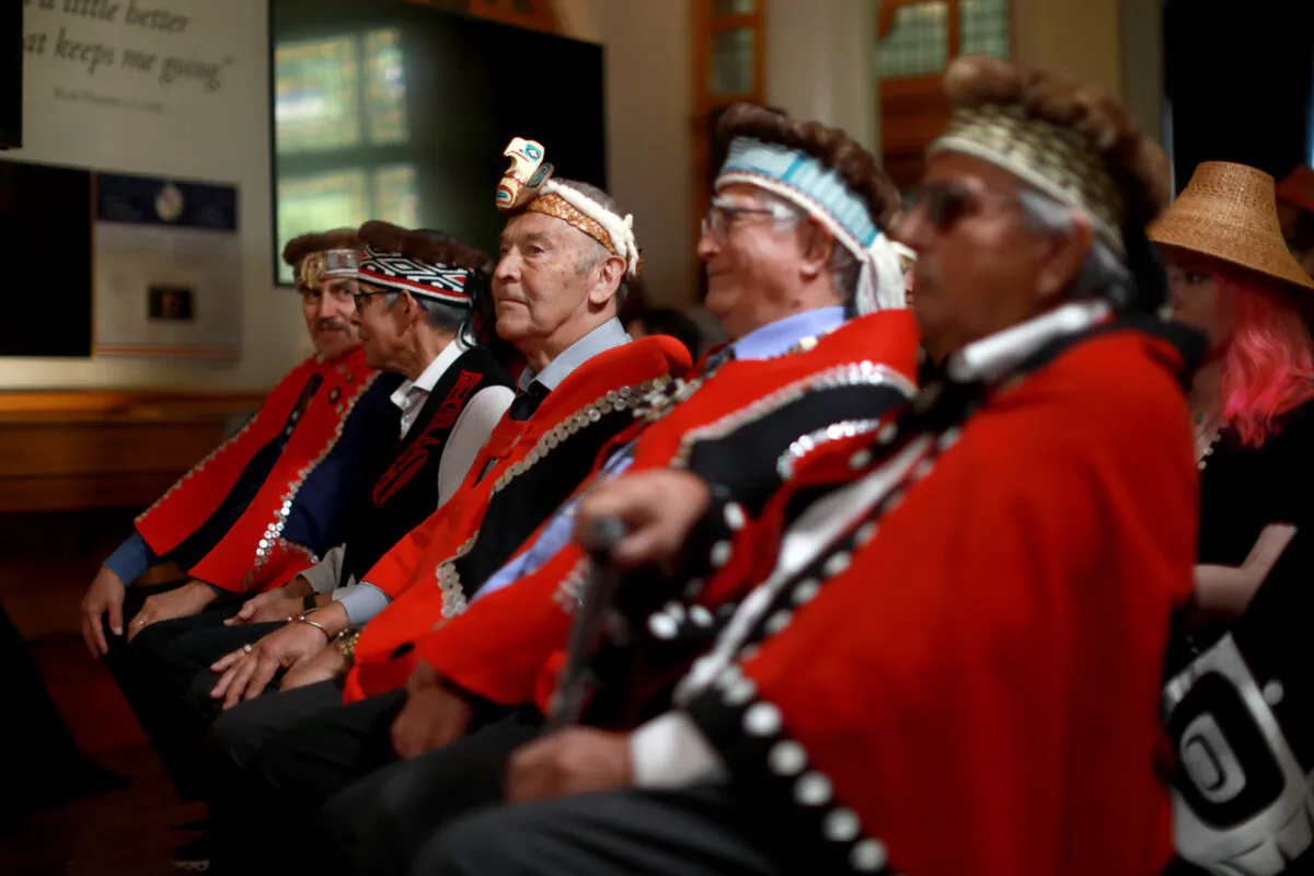 Haida Nation Hereditary Chiefs (L-R): 7idansuu, Nang Jingwas, Gitkun, Gaahlaay, and Stithlda look on during a ceremony about recognizing the Aboriginal title throughout Haida Gwaii while in the Hall of Honour in the legislature, in Victoria, on April 22, 2024. (The Canadian Press/Chad Hipolito)