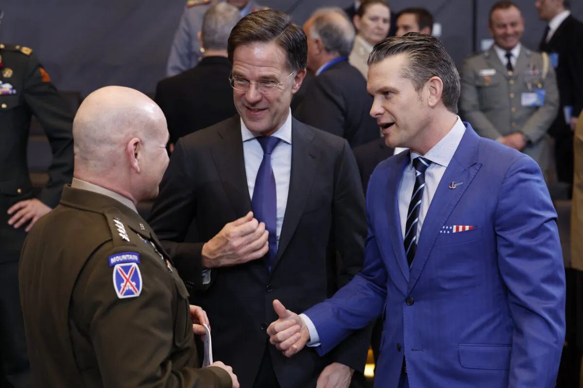 U.S. Defence Secretary Pete Hegseth (R) speaks with NATO Secretary General Mark Rutte (C) and NATO's Supreme Allied Commander Europe General Christopher Cavoli during a meeting at NATO headquarters in Brussels on Feb. 13, 2025. (AP Photo/Geert Vanden Wijngaert) 