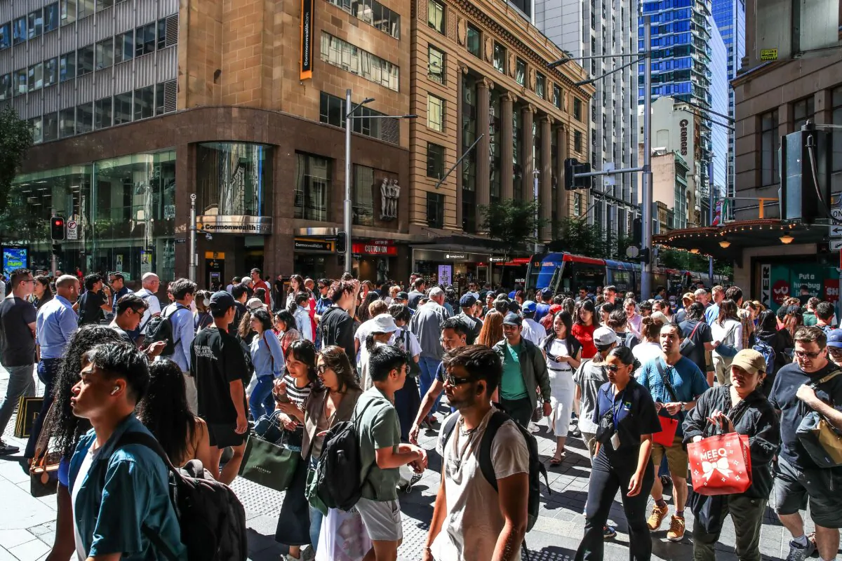 People cross a road near Pitt Street Mall in Sydney CBD, Australia, on Dec. 24, 2024. (Roni Bintang/Getty Images)