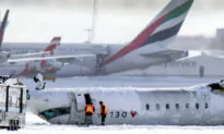 Day in Photos: Plane Crash in Canada, US-Russia Negotiations, and Snow Maze in Poland