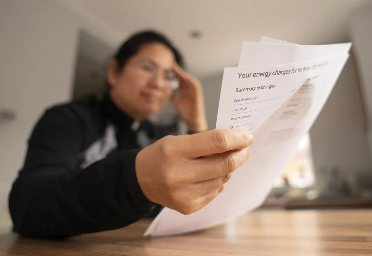 A woman looking at an energy bill in an undated file photo. (Danny Lawson/PA)