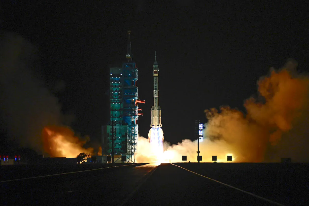 A long March-2F carrier rocket carrying the Shenzhou-19 spacecraft and crew of three astronauts lifts off from the Jiuquan Satellite Launch Center, in the Gobi desert, northwest China, on Oct. 30, 2024. (Adek Berry/AFP via Getty Images)