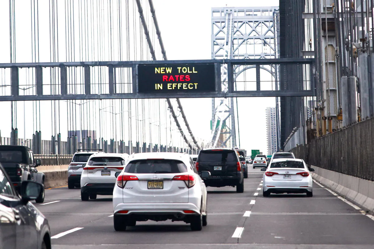Cars pass under a congestion pricing warning sign on George Washington Bridge as congestion pricing takes effect in New York City on Jan. 5, 2025. (Kena Betancur/AFP via Getty Images)