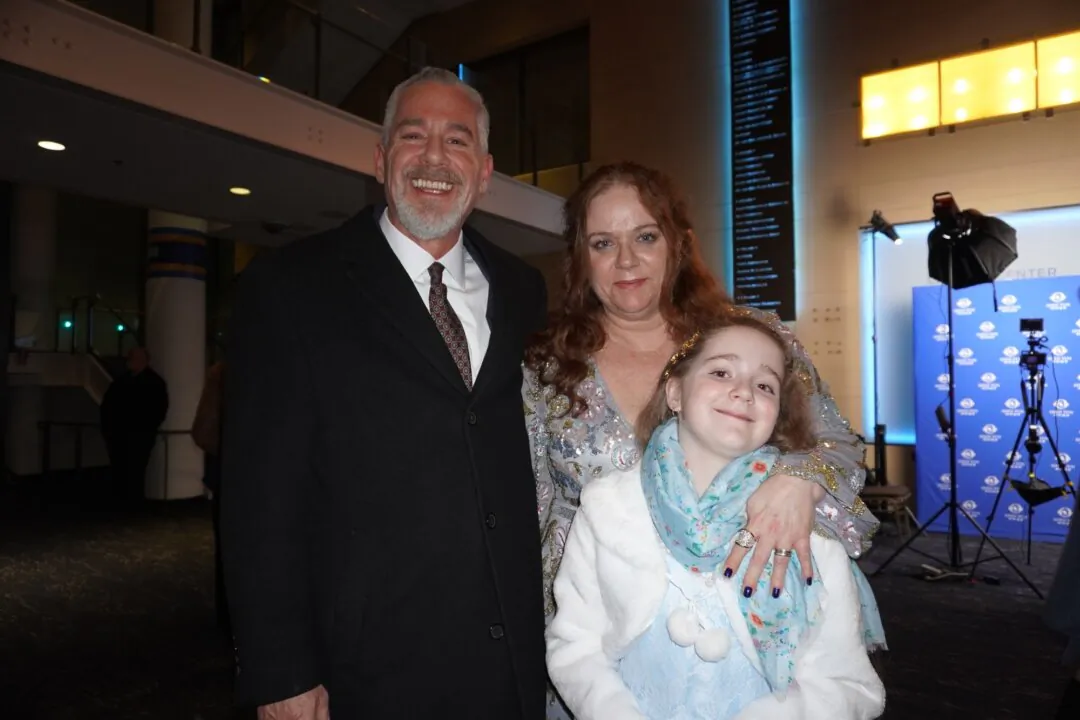 Paul and Kimberly Collins with their daughter at Shen Yun at the Cannon Center for the Performing Arts in Memphis, on Feb. 18, 2025. (Sally Sun/The Epoch Times)