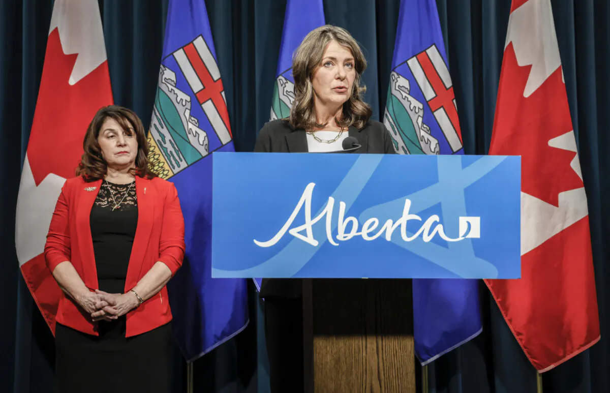 Alberta Premier Danielle Smith (R), and Minister of Health Adriana LaGrange provide an update on the government's response to allegations by former Alberta Health Services CEO Athana Mentzelopoulos, in Calgary on Feb. 19, 2025. (Jeff McIntosh/The Canadian Press)