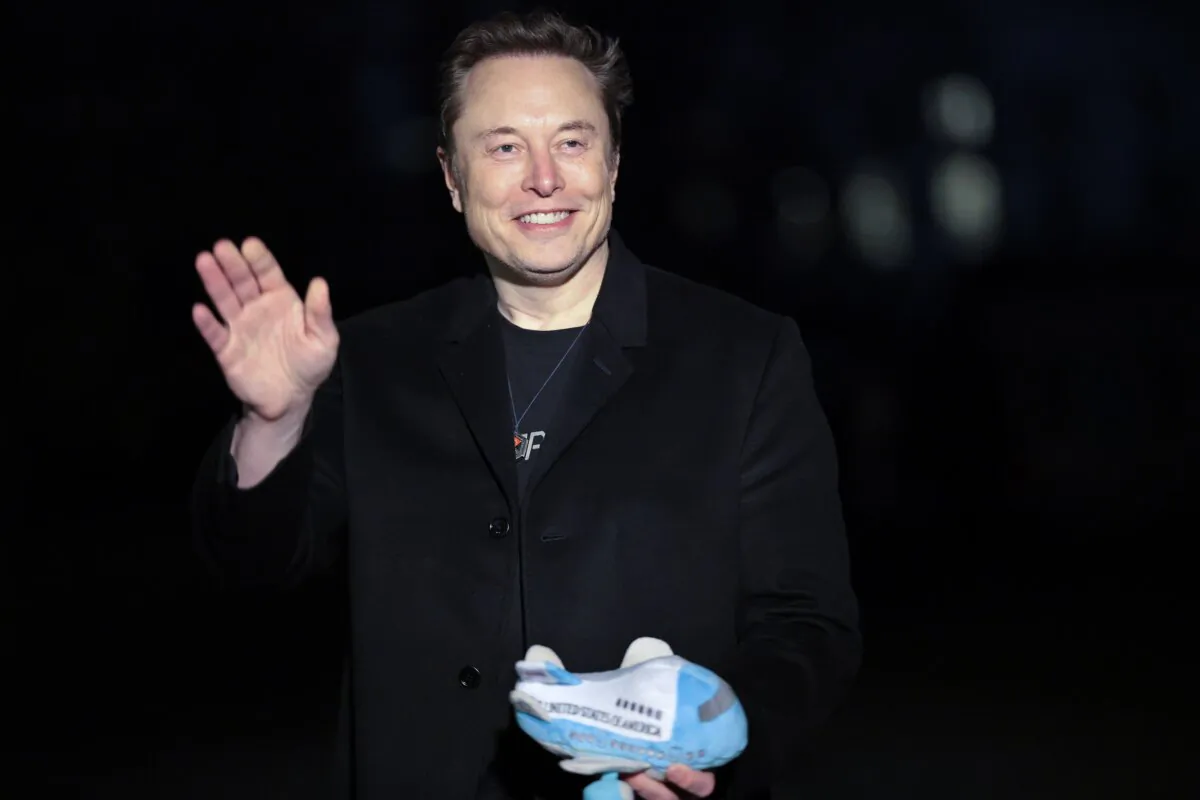 Tesla and SpaceX CEO Elon Musk holds up an Air Force One stuffed toy as he walks from the presidential helicopter Marine One on the South Lawn of the White House on Feb. 19, 2025. (Win McNamee/Getty Images)