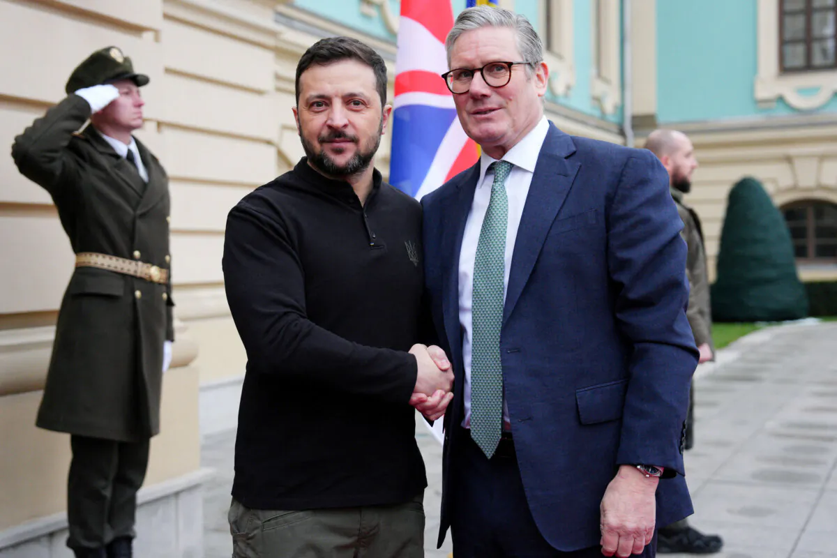British Prime Minister Sir Keir Starmer (R) shakes hands with Ukrainian President Volodymyr Zelenskyy upon Starmer's arrival for a meeting in Kyiv, Ukraine, on Jan. 16, 2025. (Carl Court/Pool/AFP via Getty Images)