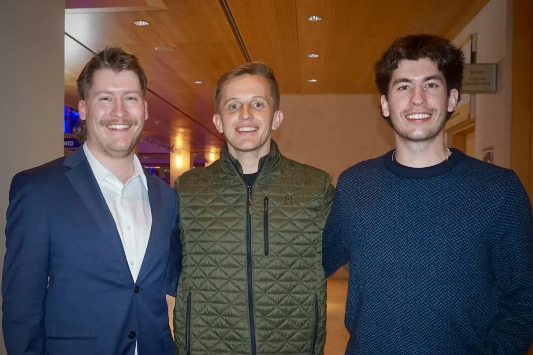 Spencer Jordan (L) and his colleagues attended Shen Yun's evening performance at the Overture Center for the Arts on Feb. 19, 2025. (Yeawen Hung/The Epoch Times)