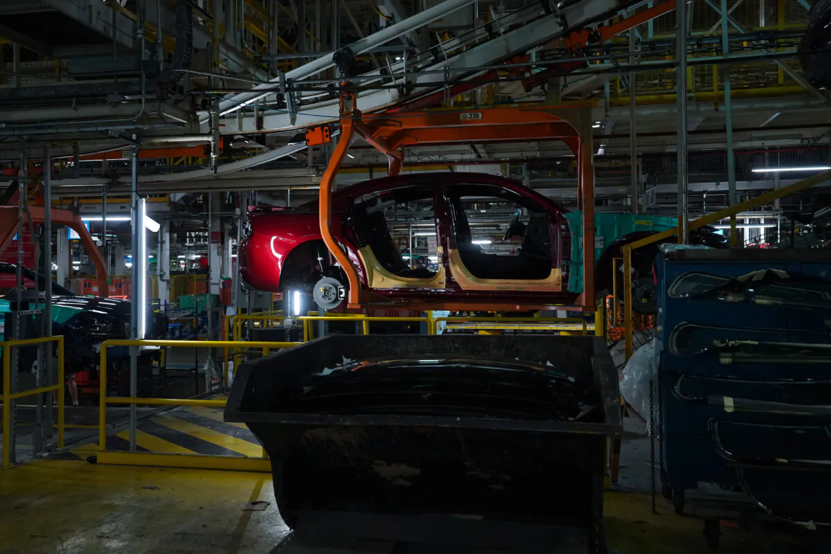 Cars pass along the assembly line at the Stellantis plant in Brampton, Ont., on July 21, 2023. (The Canadian Press/Chris Young)