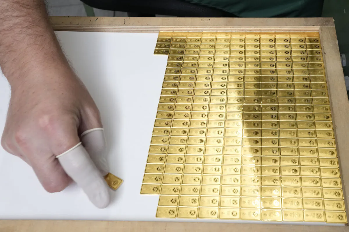 Investment gold bars are arranged for storage at the Mint of Poland in Warsaw, Poland, on June 25, 2024. (AP Photo/Czarek Sokolowski)