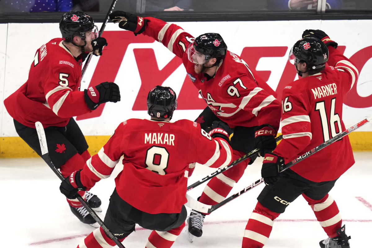 Canada's Connor McDavid (97) celebrates after his winning goal against the United States during an overtime period of the 4 Nations Face-Off hockey game, in Boston on Feb. 20, 2025. (AP Photo/Charles Krupa)