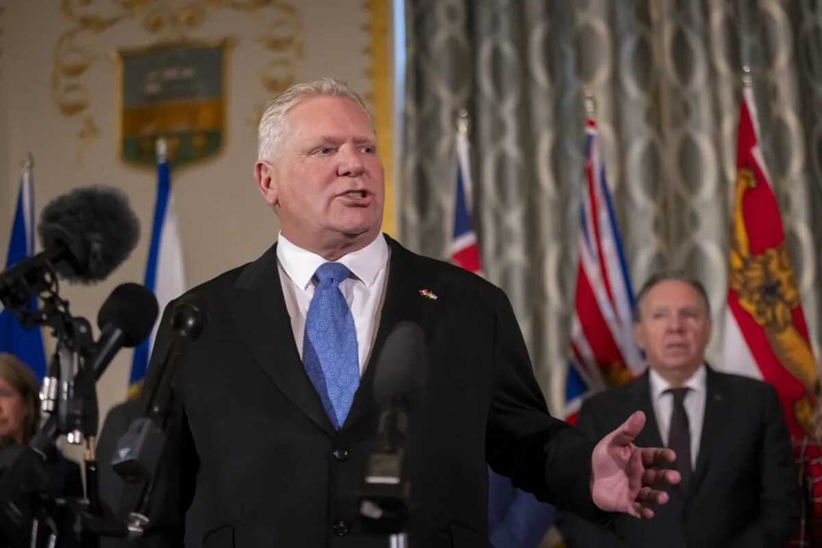 Premier of Ontario Doug Ford speaks to reporters, accompanied by other Council of the Federation members, at the Mayflower Hotel in Washington, on Feb. 12, 2025. (The Canadian Press/AP-Ben Curtis)