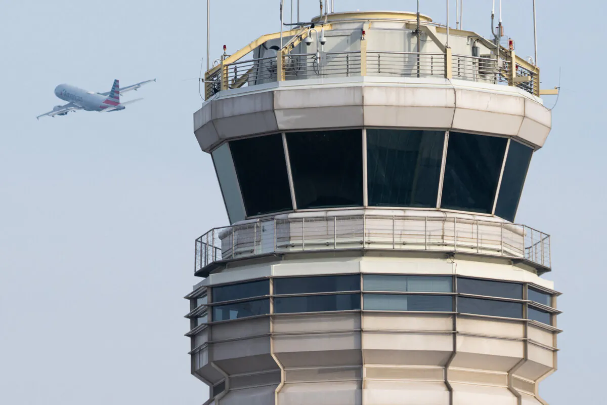 An American Airlines Airbus plane takes off past the air traffic control tower at Ronald Reagan Washington National Airport in Arlington, VA., on Jan. 11, 2023. (Saul Loeb/AFP via Getty Images)