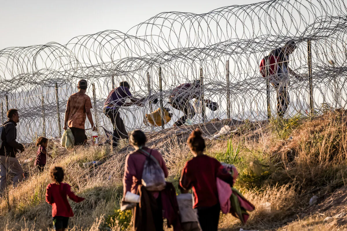 Illegal immigrants cross into the United States from Mexico to be processed by Border Patrol agents in El Paso, Texas, on May 8, 2023. (John Moore/Getty Images)