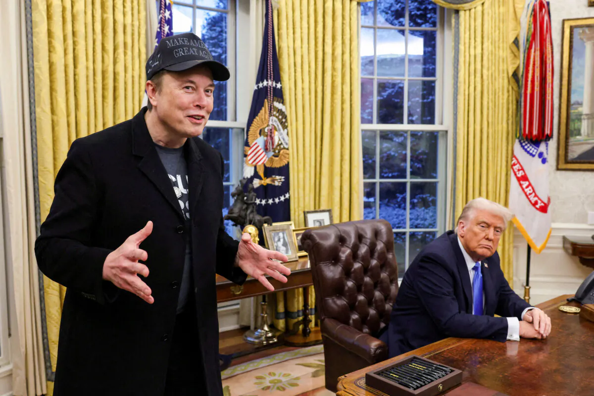 Elon Musk (L) speaks next to President Donald Trump in the Oval Office of the White House in Washington on Feb. 11, 2025. (Kevin Lamarque/Reuters)
