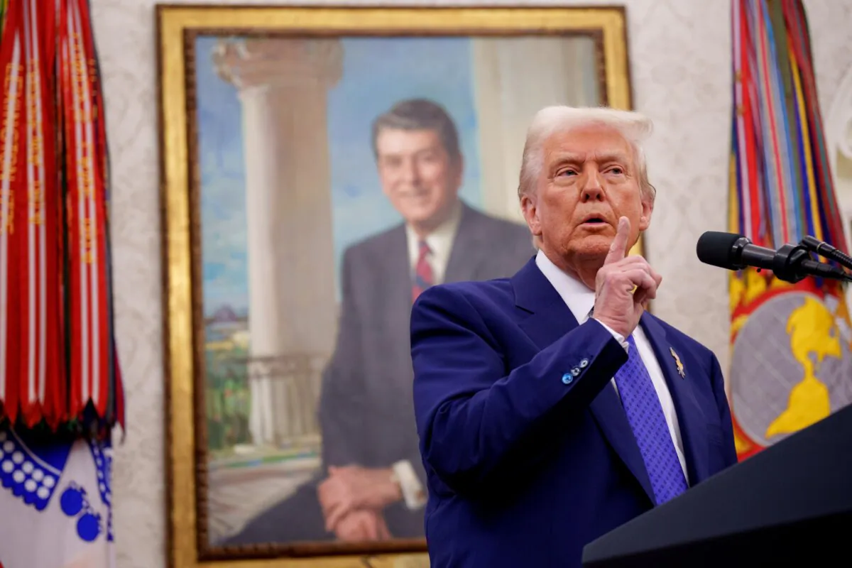 President Donald Trump gestures as he takes a question from a reporter in the Oval Office at the White House in Washington on Feb. 12, 2025. (Andrew Harnik/Getty Images)