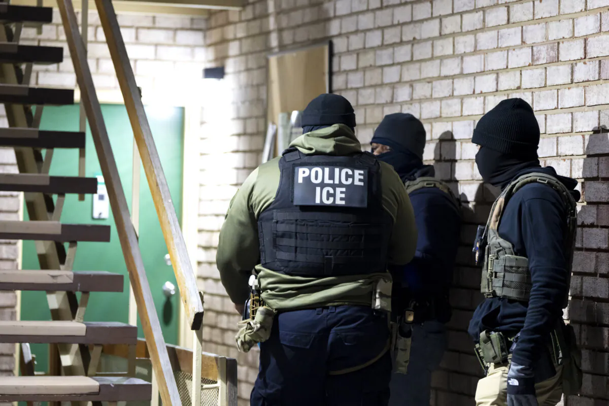U.S. Immigration and Customs Enforcement officers wait to detain a person in Silver Spring, Md., on Jan. 27, 2025. (Alex Brandon/AP Photo)