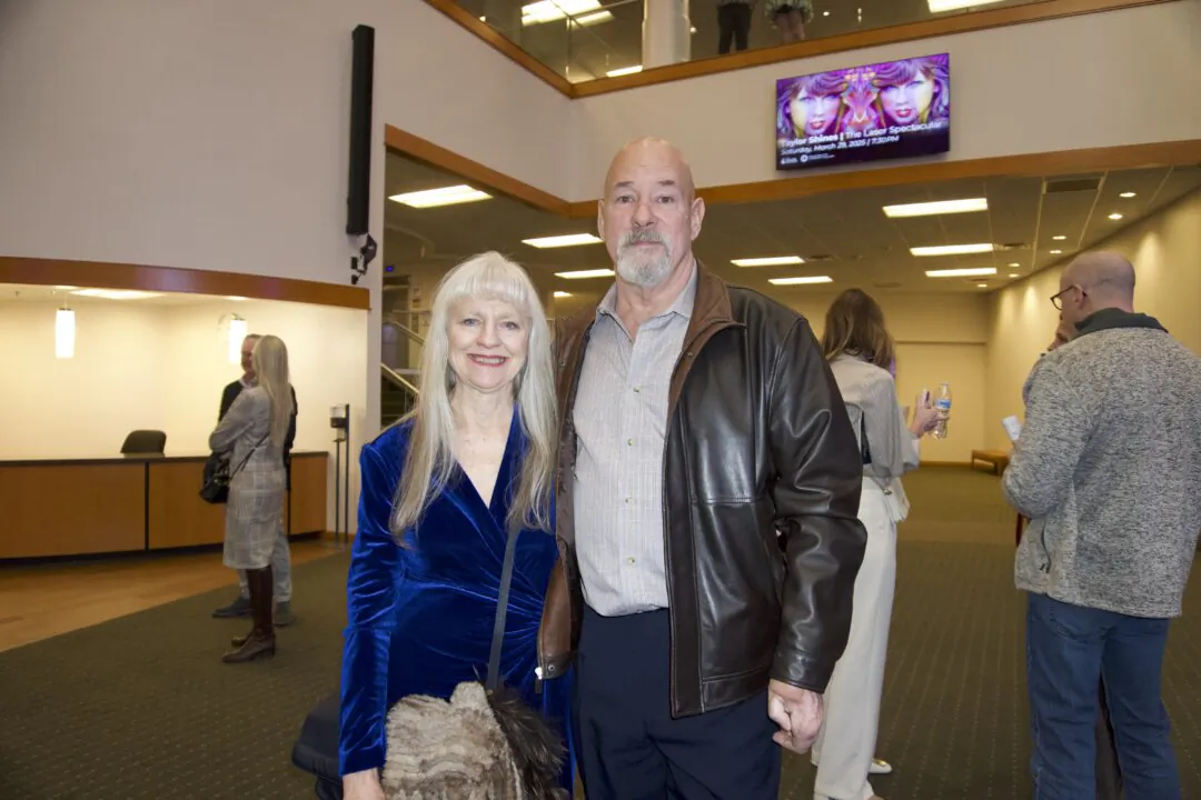 Richard Felix (R) enjoyed Shen Yun's evening performance at the the OCCC Visual and Performing Arts Center Theater on the evening of Feb. 22, 2025. (Sally Sun/The Epoch Times)