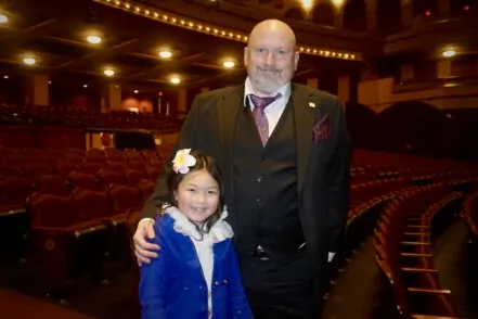 Michael Reinicker and his daughter enjoyed Shen Yun Performing Arts at the Miller High Life Theatre in Milwaukee, Wis., on Feb. 22, 2025. (Yeawen Hung/The Epoch Times)