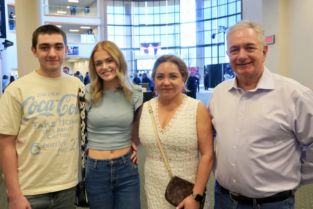 (L-R) Charlie Thompson, River Kahler, and Marcia and Matt Thompson attend Shen Yun Performing Arts at the OCCC Visual and Performing Arts Center Theater in Oklahoma City, Okla., on Feb. 23, 2025. (Sonia Wu/The Epoch Times)