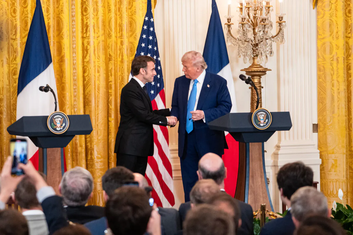 French President Emmanuel Macron (L) and U.S. President Donald Trump speak during a press conference at the White House in Washington on Feb. 24, 2025. (Madalina Vasiliu/The Epoch Times)