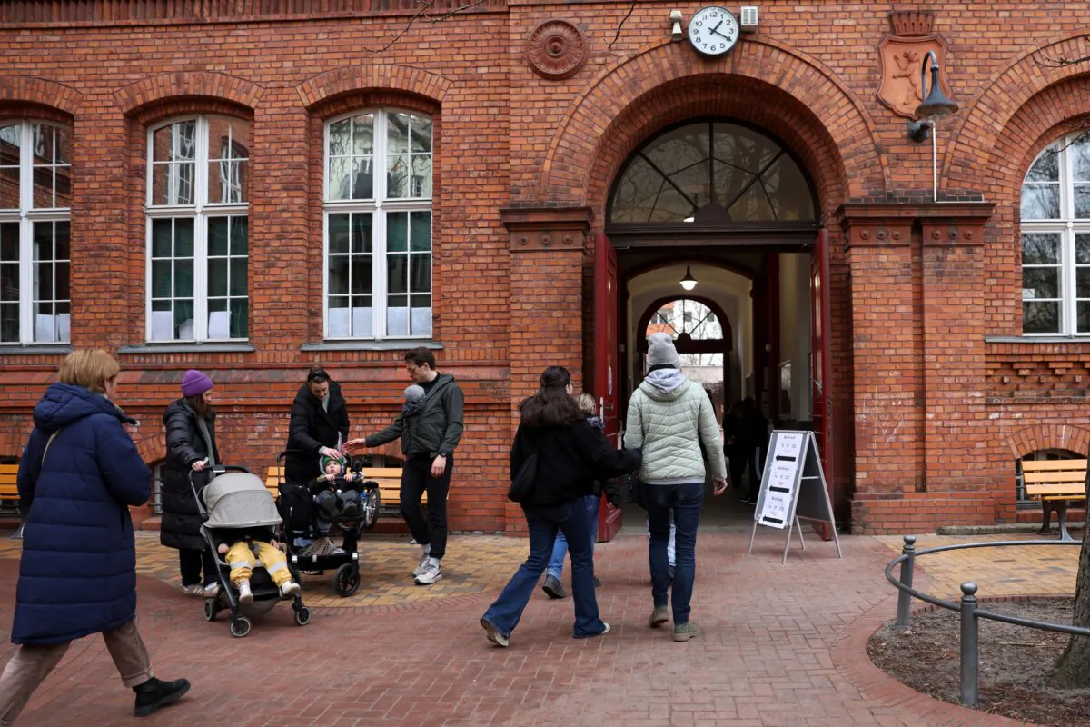 Voters arrive at a polling station to cast their ballots in federal parliamentary elections in Berlin, Germany, on Feb. 23, 2025. (Maryam Majd/Getty Images)