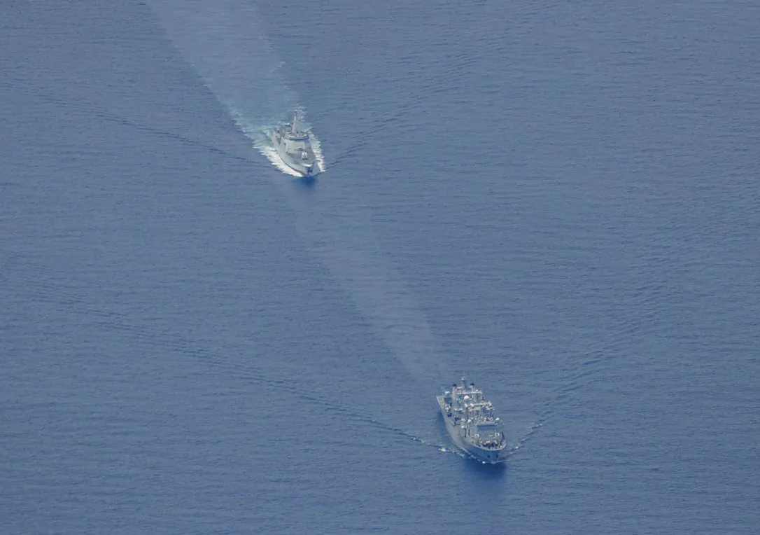 Chinese People’s Liberation Army-Navy Renhai-class cruiser Zunyi, and Fuchi-class replenishment vessel Weishanhu. (Courtesy of the Australian Department of Defence)
