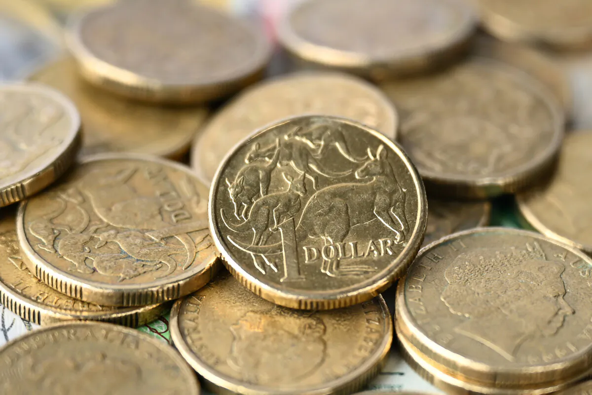 Australian dollar coins and banknotes in Melbourne, Australia on April 4, 2024. (AAP Image/Joel Carrett)
