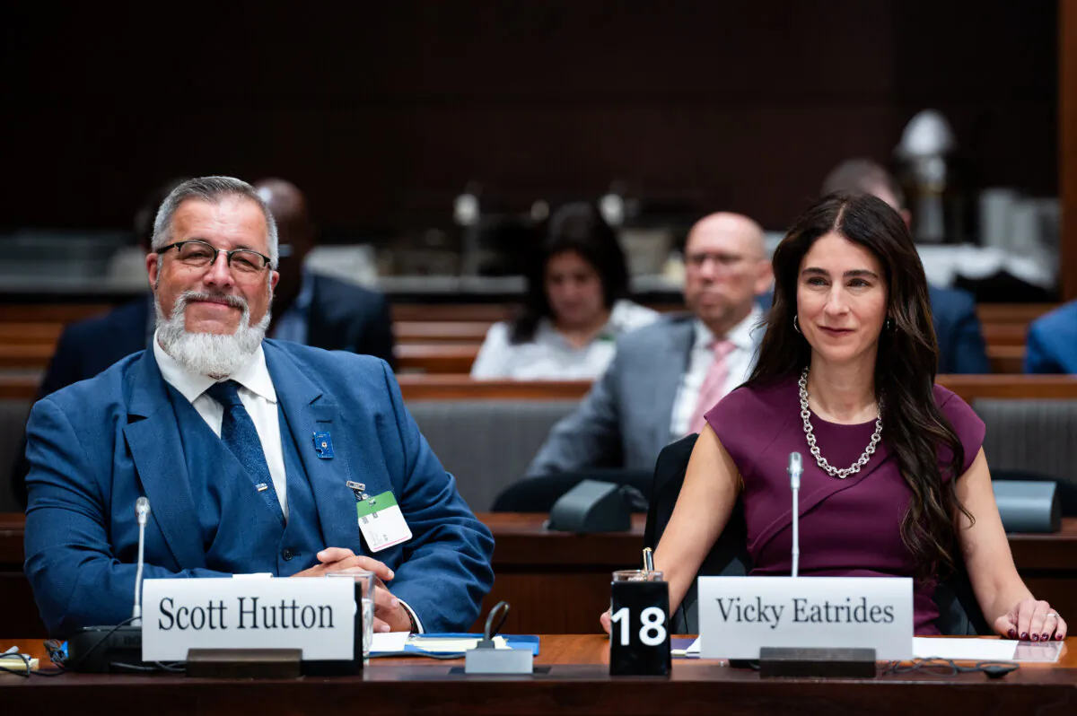 Vicky Eatrides (R), chairperson and CEO of the Canadian Radio-television and Telecommunications Commission, and Scott Hutton, chief of consumer, research and communications at the CRTC, wait to appear before a standing committee in Ottawa on Oct. 5, 2023. (The Canadian Press/Spencer Colby)