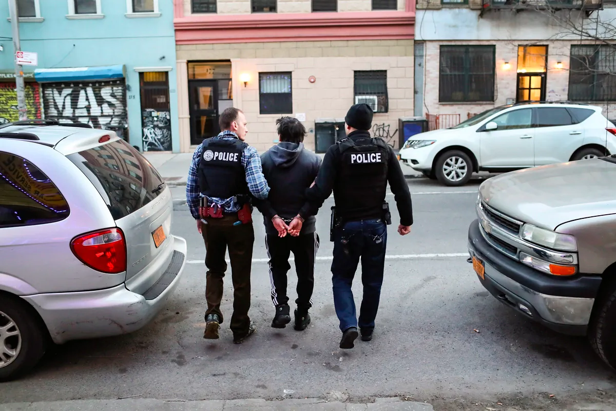 Immigration and Customs Enforcement officers arrest an illegal immigrant during a raid in the Bushwick neighborhood of Brooklyn in New York City on April 11, 2018. (John Moore/Getty Images)